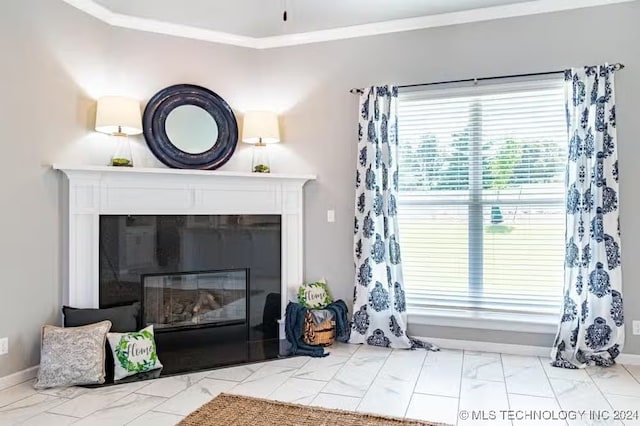 living room with a tile fireplace and ornamental molding