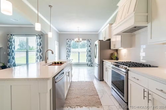 kitchen with premium range hood, white cabinets, sink, an island with sink, and stainless steel appliances