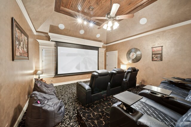 cinema featuring carpet, ceiling fan, crown molding, and wooden ceiling