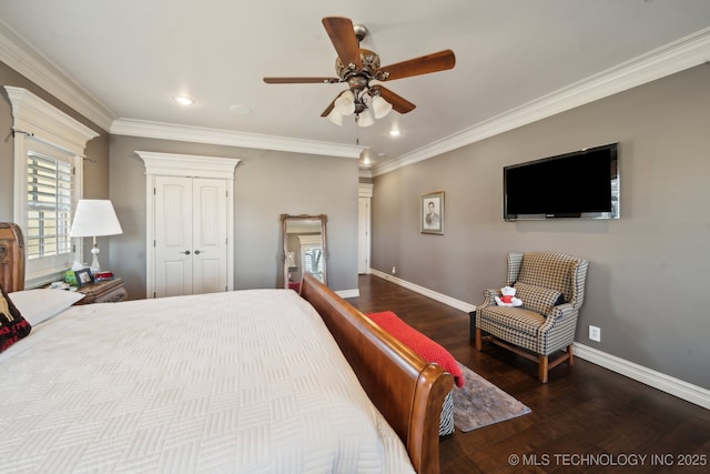 bedroom with ornamental molding, wood finished floors, and baseboards