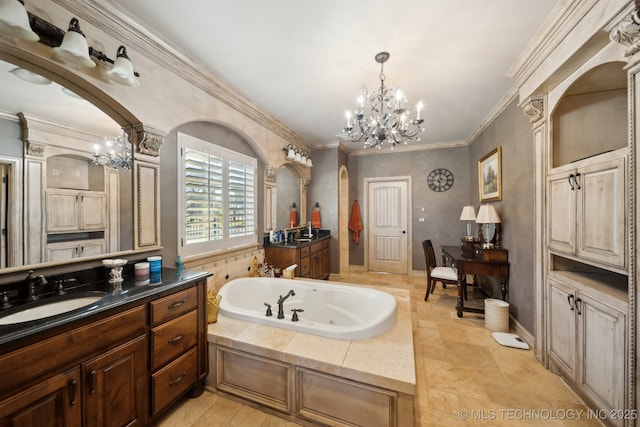 bathroom featuring crown molding, a sink, an inviting chandelier, two vanities, and a whirlpool tub