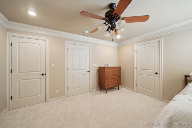 carpeted bedroom featuring ceiling fan, recessed lighting, ornamental molding, and baseboards