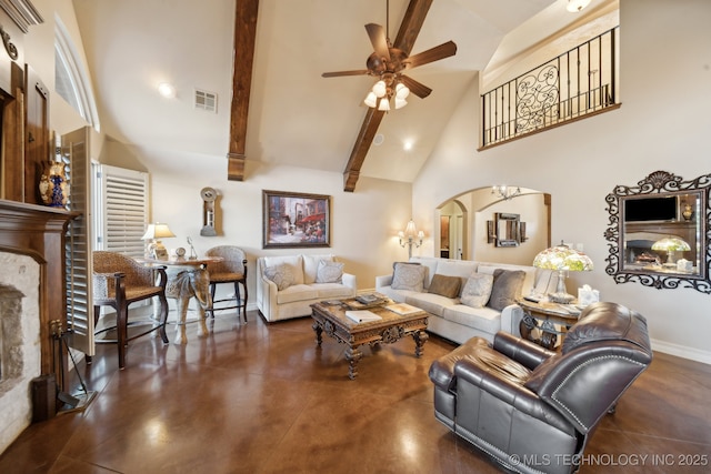 living room featuring ceiling fan, high vaulted ceiling, beamed ceiling, and arched walkways