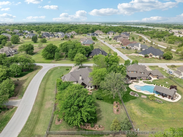birds eye view of property with a residential view