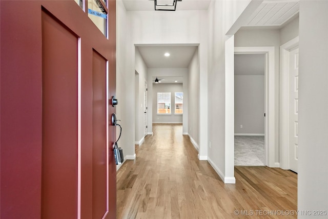 entrance foyer featuring ceiling fan and light hardwood / wood-style flooring