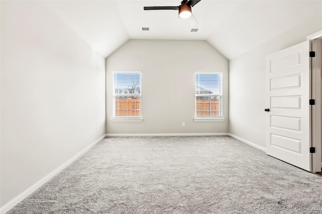 interior space with ceiling fan and vaulted ceiling