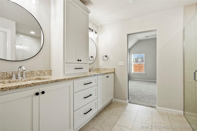 bathroom featuring tile patterned flooring, vanity, and an enclosed shower