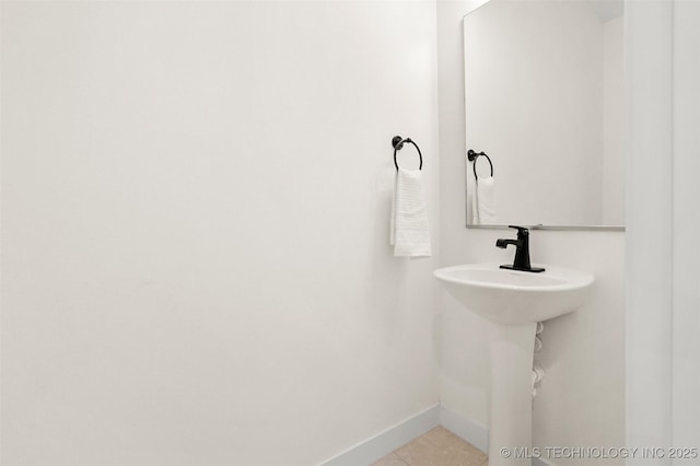 bathroom with tile patterned floors