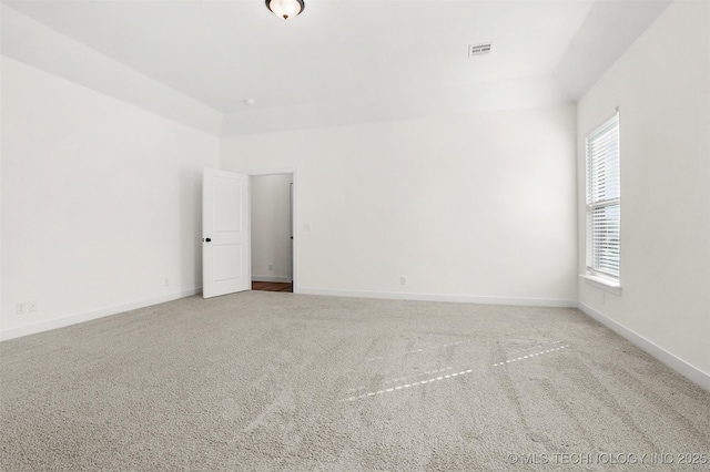 unfurnished room with light colored carpet