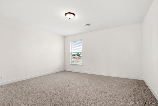 spare room with carpet floors