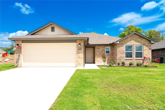 ranch-style home featuring central AC, a front yard, and a garage