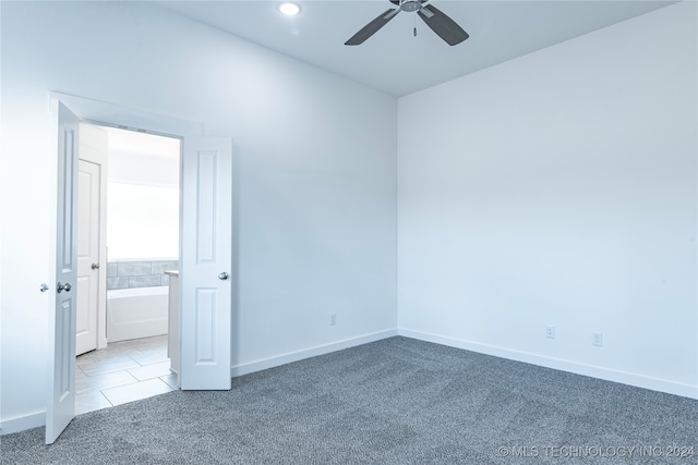 carpeted empty room with ceiling fan