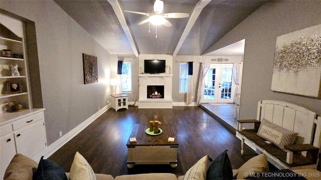 living room featuring french doors, ceiling fan, a healthy amount of sunlight, and dark hardwood / wood-style floors