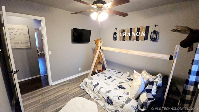 bedroom featuring hardwood / wood-style floors and ceiling fan