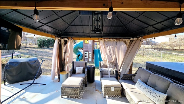 view of patio with grilling area, a gazebo, and an outdoor hangout area