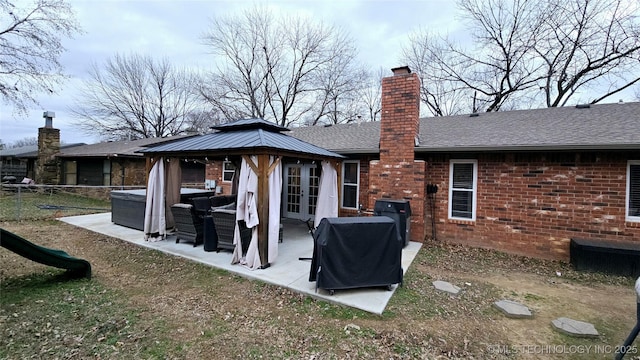 rear view of house with a gazebo and french doors