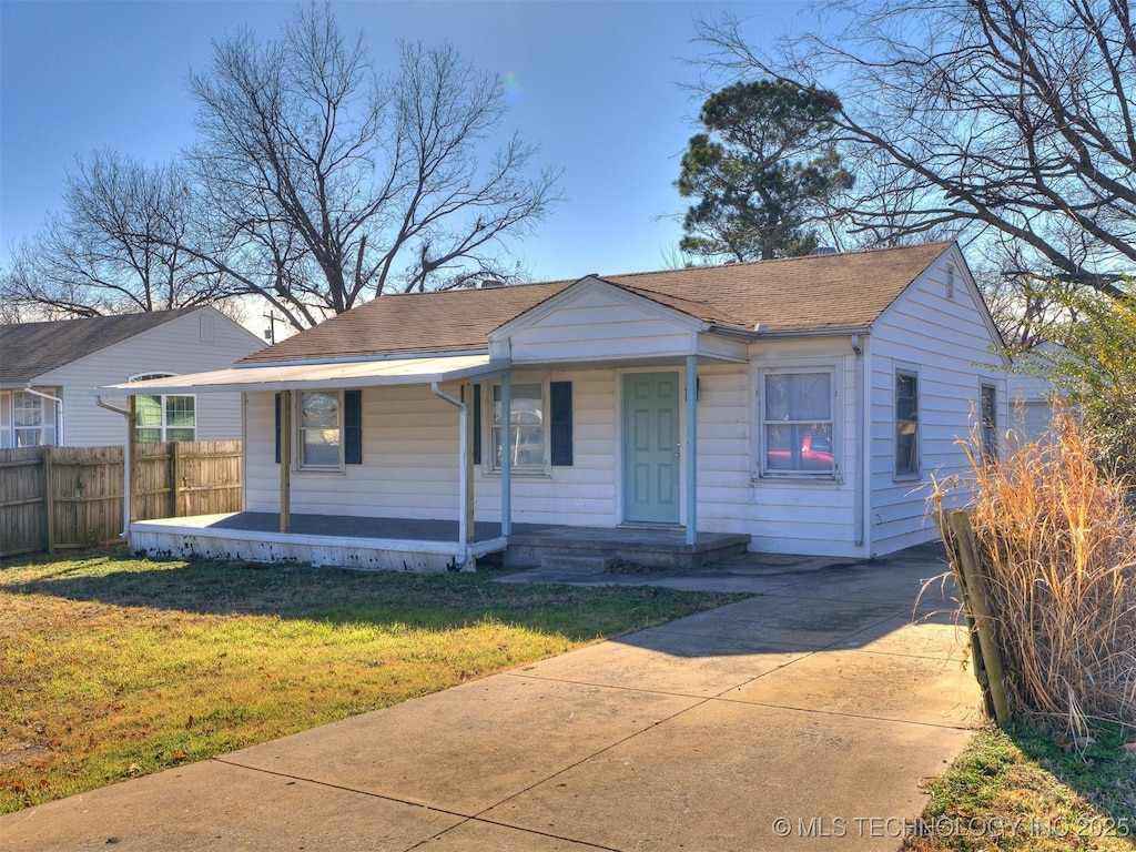 view of front of home featuring covered porch and a front yard