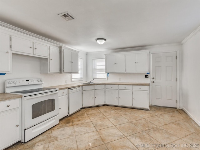 kitchen featuring white appliances, sink, light tile patterned floors, ornamental molding, and white cabinetry