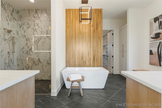 bathroom featuring vanity and independent shower and bath