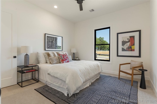 bedroom with light colored carpet and ceiling fan