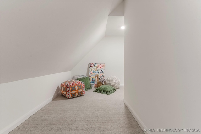 playroom featuring carpet floors and vaulted ceiling