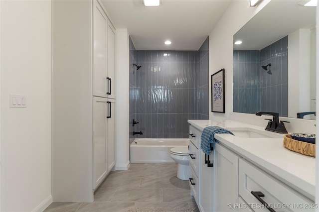 full bathroom featuring tile patterned flooring, tiled shower / bath combo, toilet, and vanity