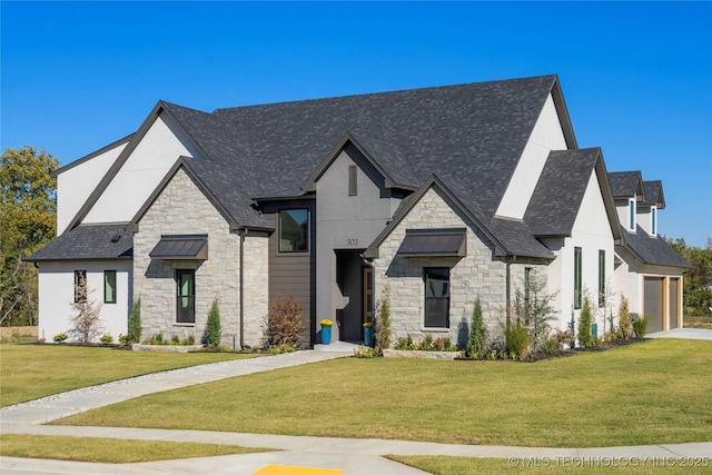 view of front of property featuring a garage and a front lawn