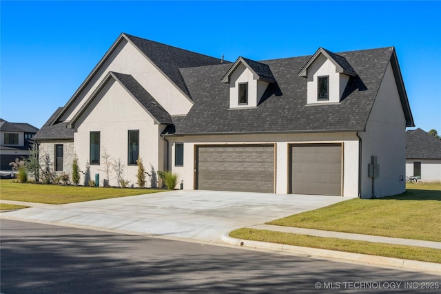 view of front of house with a garage and a front yard