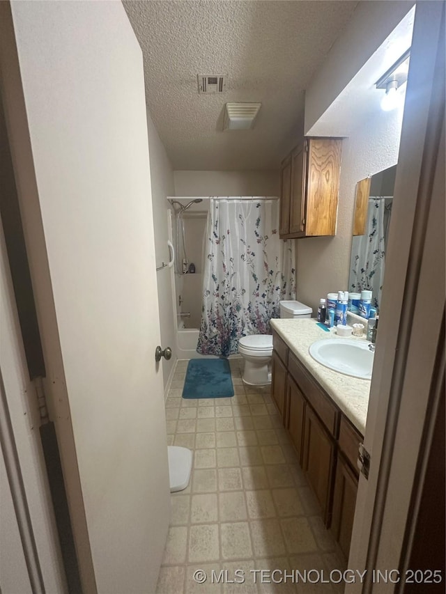 full bathroom with vanity, a textured ceiling, toilet, and shower / bathtub combination with curtain