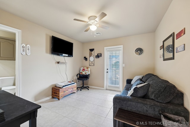 living room featuring ceiling fan and light tile patterned floors