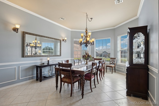 tiled dining area with a chandelier and crown molding