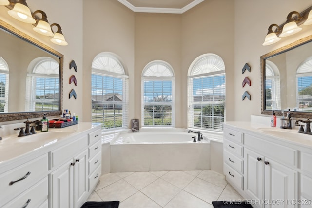 bathroom featuring tile patterned flooring, a bath, plenty of natural light, vanity, and ornamental molding