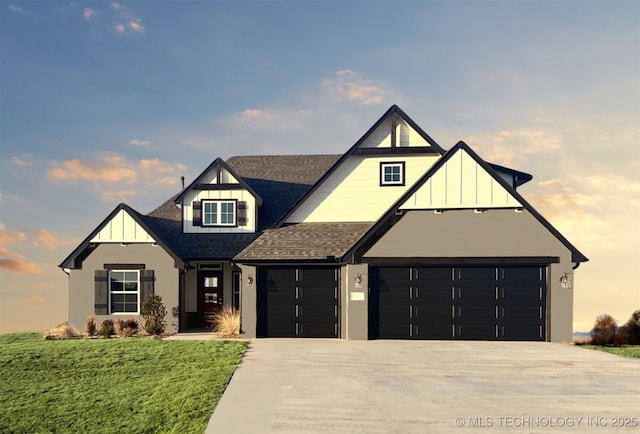 view of front of property featuring a yard and a garage