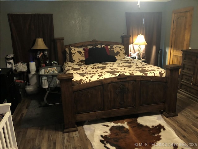 bedroom featuring hardwood / wood-style floors