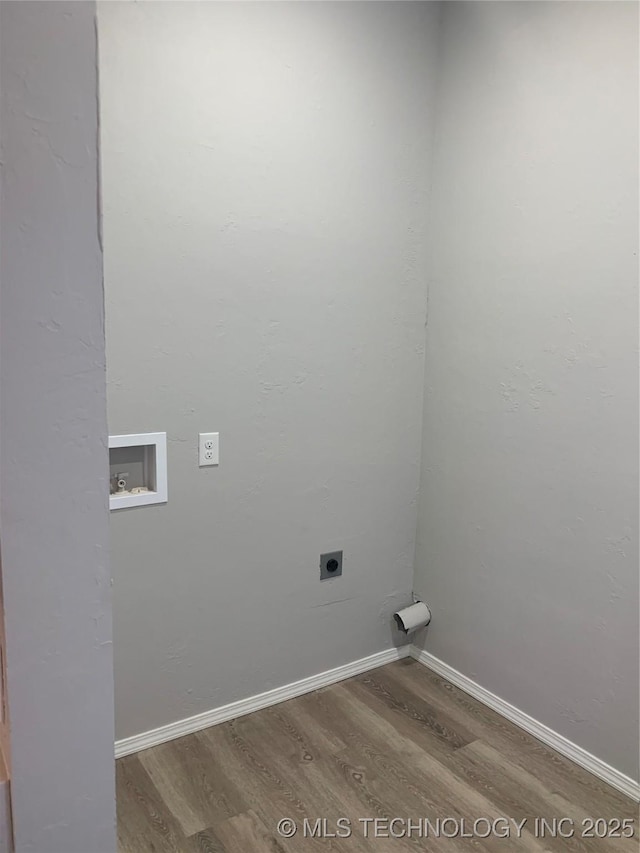 laundry area with hookup for an electric dryer, hardwood / wood-style floors, and washer hookup