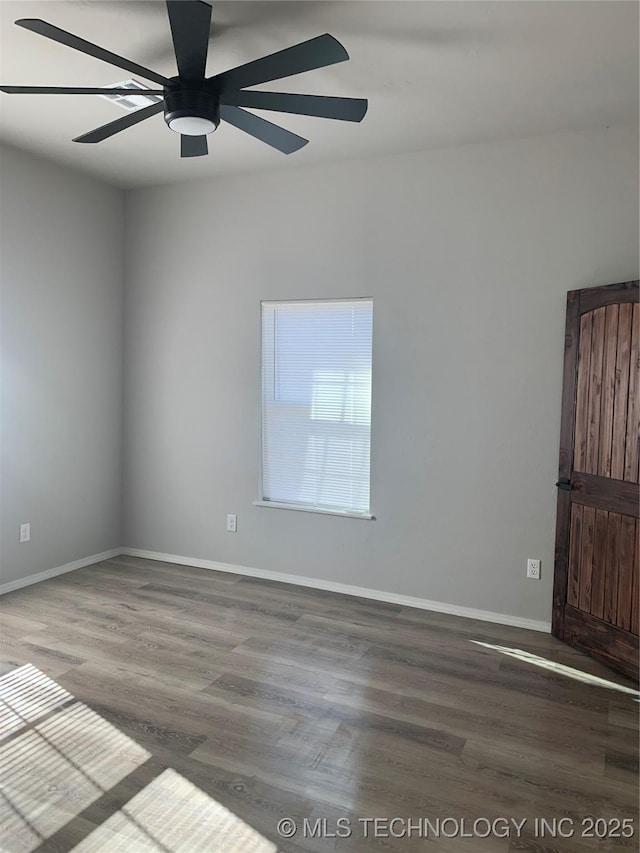 unfurnished room with ceiling fan and hardwood / wood-style flooring