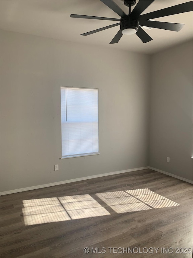 unfurnished room featuring ceiling fan and dark hardwood / wood-style floors