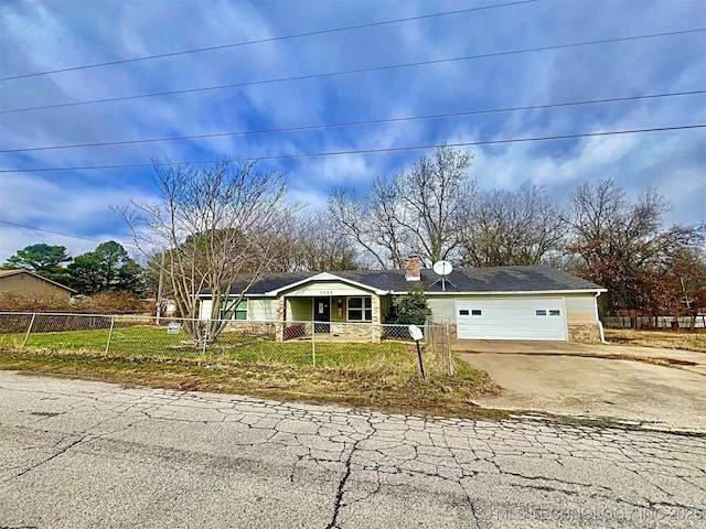 ranch-style house featuring a garage