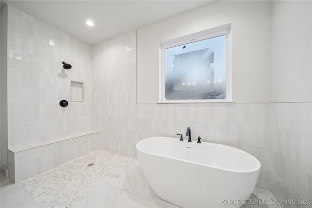 bathroom with independent shower and bath and tile walls