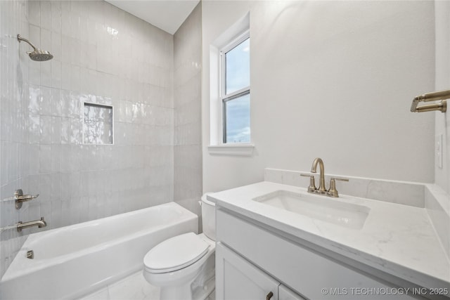 bathroom featuring shower / washtub combination, toilet, and vanity