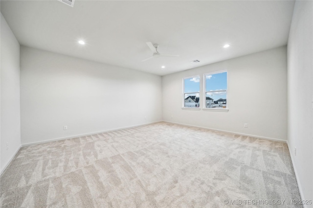 spare room with recessed lighting, carpet floors, baseboards, and ceiling fan