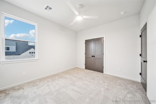 2509 E 134th Cir, Bixby, OK 74008 - unfurnished bedroom with carpet floors, a closet, and a ceiling fan