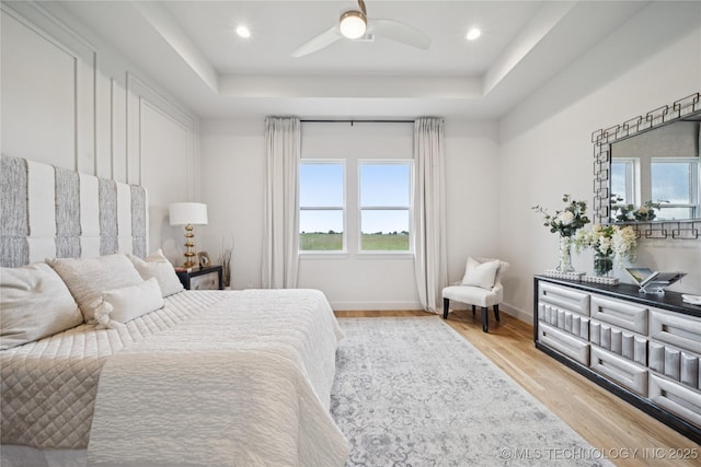 2509 E 134th Cir, Bixby, OK 74008 - bedroom with a raised ceiling, wood finished floors, ceiling fan, and recessed lighting