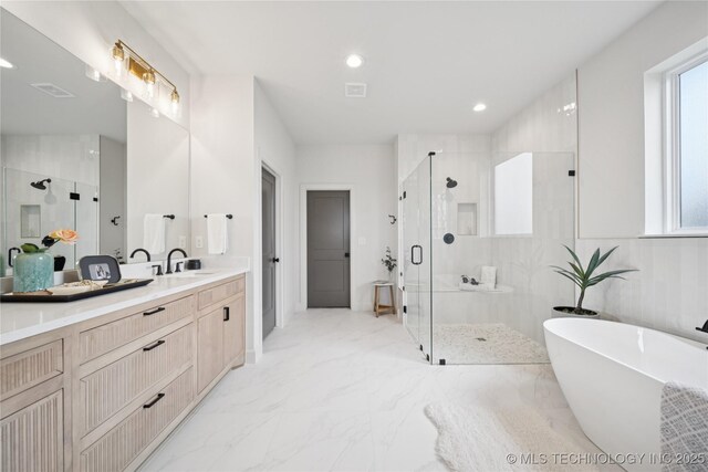 2509 E 134th Cir, Bixby, OK 74008 - full bath featuring a shower stall, marble finish flooring, vanity, healthy amount of natural light, and recessed lighting