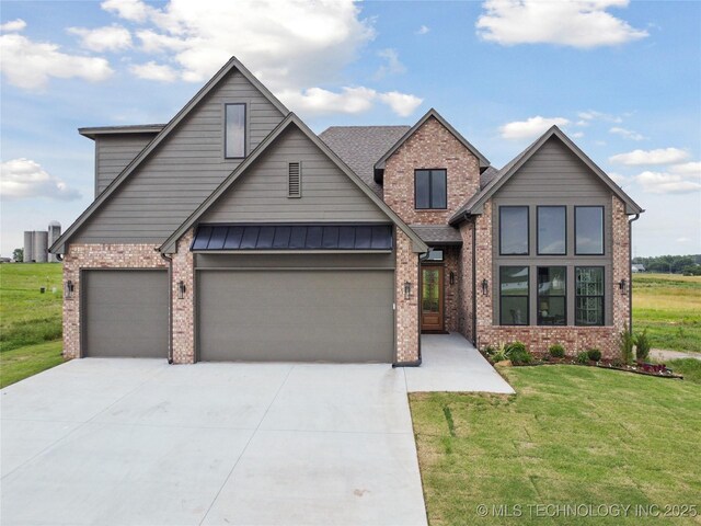 2509 E 134th Cir, Bixby, OK 74008 - view of front of home with brick siding, an attached garage, a front yard, concrete driveway, and a shingled roof