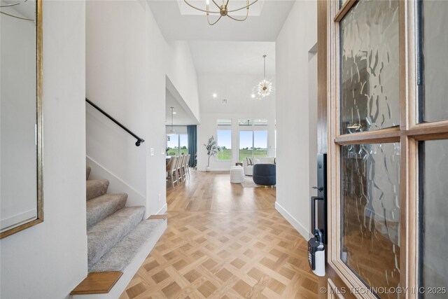 2509 E 134th Cir, Bixby, OK 74008 - entrance foyer with a chandelier, a high ceiling, and stairs