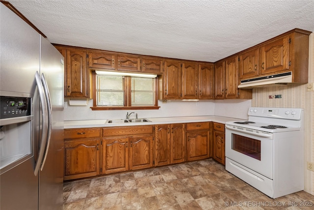 kitchen featuring white range with electric cooktop, stainless steel fridge with ice dispenser, sink, and a textured ceiling