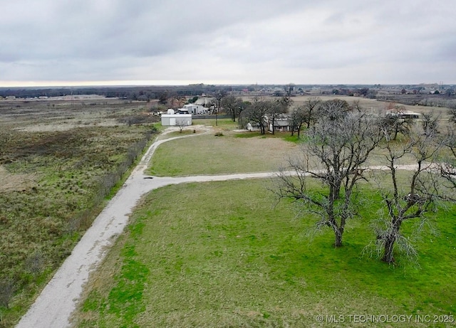 birds eye view of property with a rural view