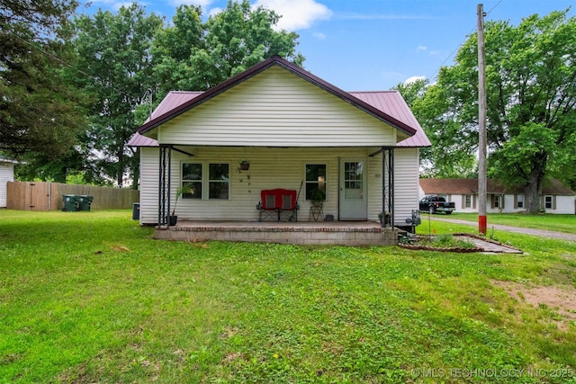 view of front of home with covered porch and a front yard