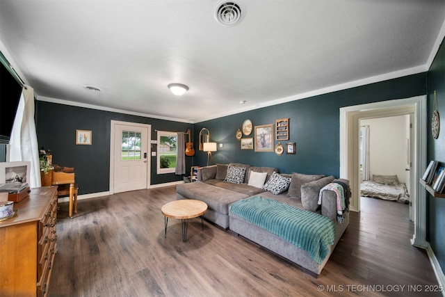 living room with dark hardwood / wood-style floors and ornamental molding